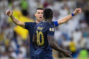 Nassr's Portuguese forward #07 Cristiano Ronaldo (back) celebrates with Nassr's Senegalese Forward #10 Sadio Mane 